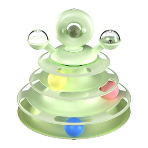 Cat chasing ball on toy tower
