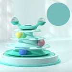 Mint green toy with colorful balls on a light gray background